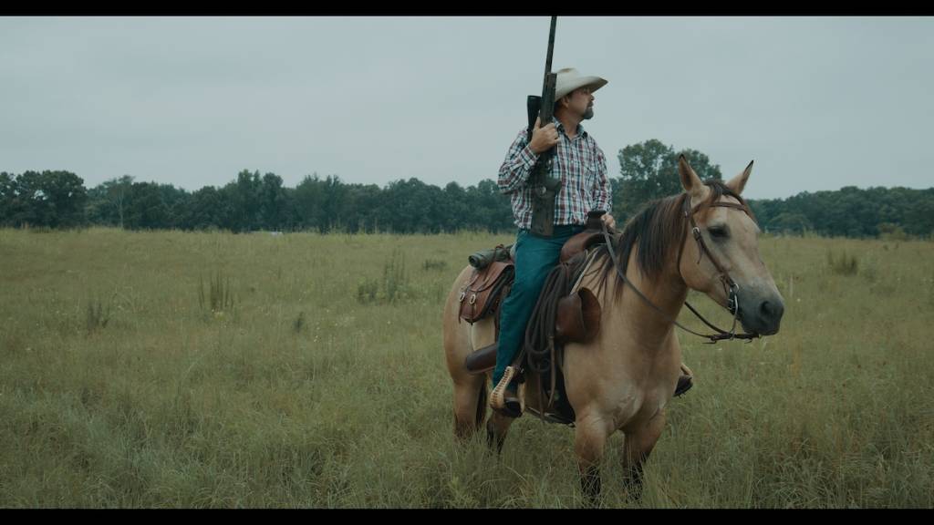 A hunter on a horse with SAPP rifle