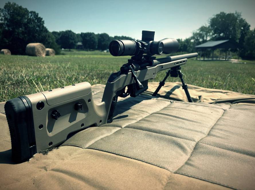 the paladin rifle with a scope waiting to be shot